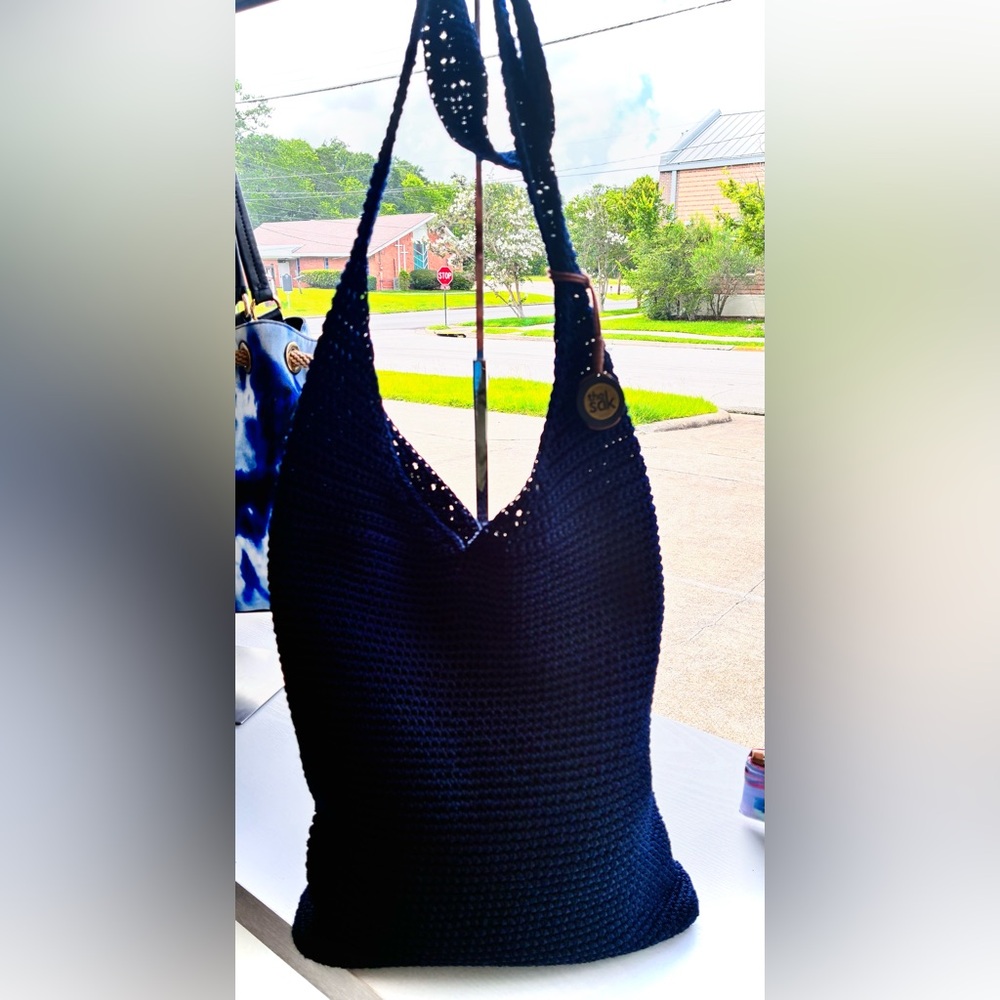 The Sak Navy Crochet Hobo Shoulder Bag with Medallion